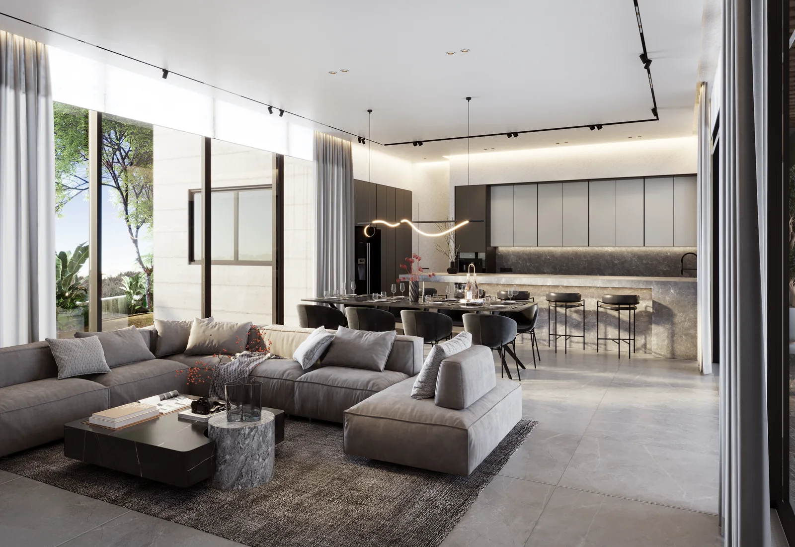 Living room and kitchen with a grey sectional sofa and full-height glazing