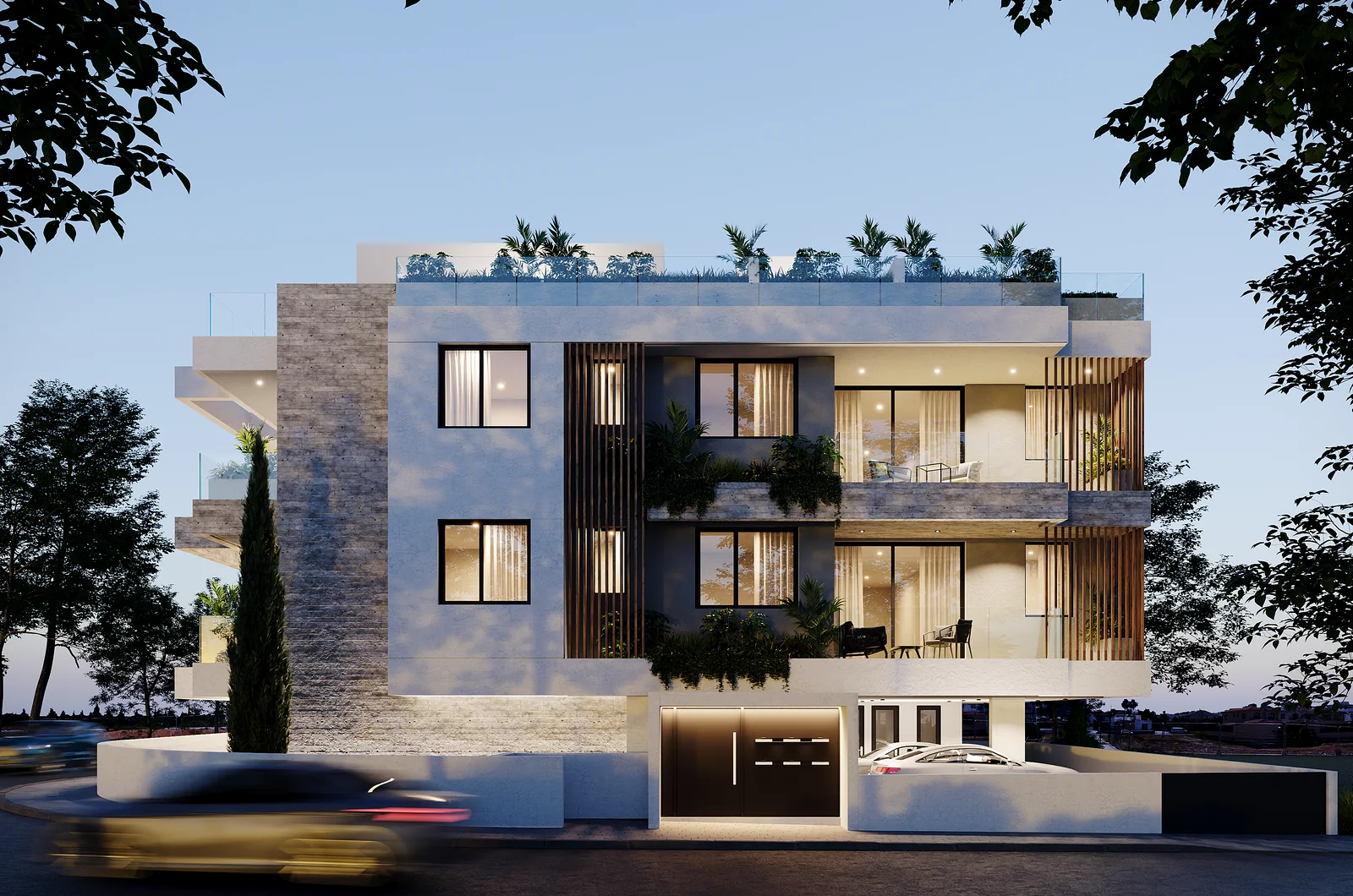 Three-storey apartment building at dusk with planted roof terraces